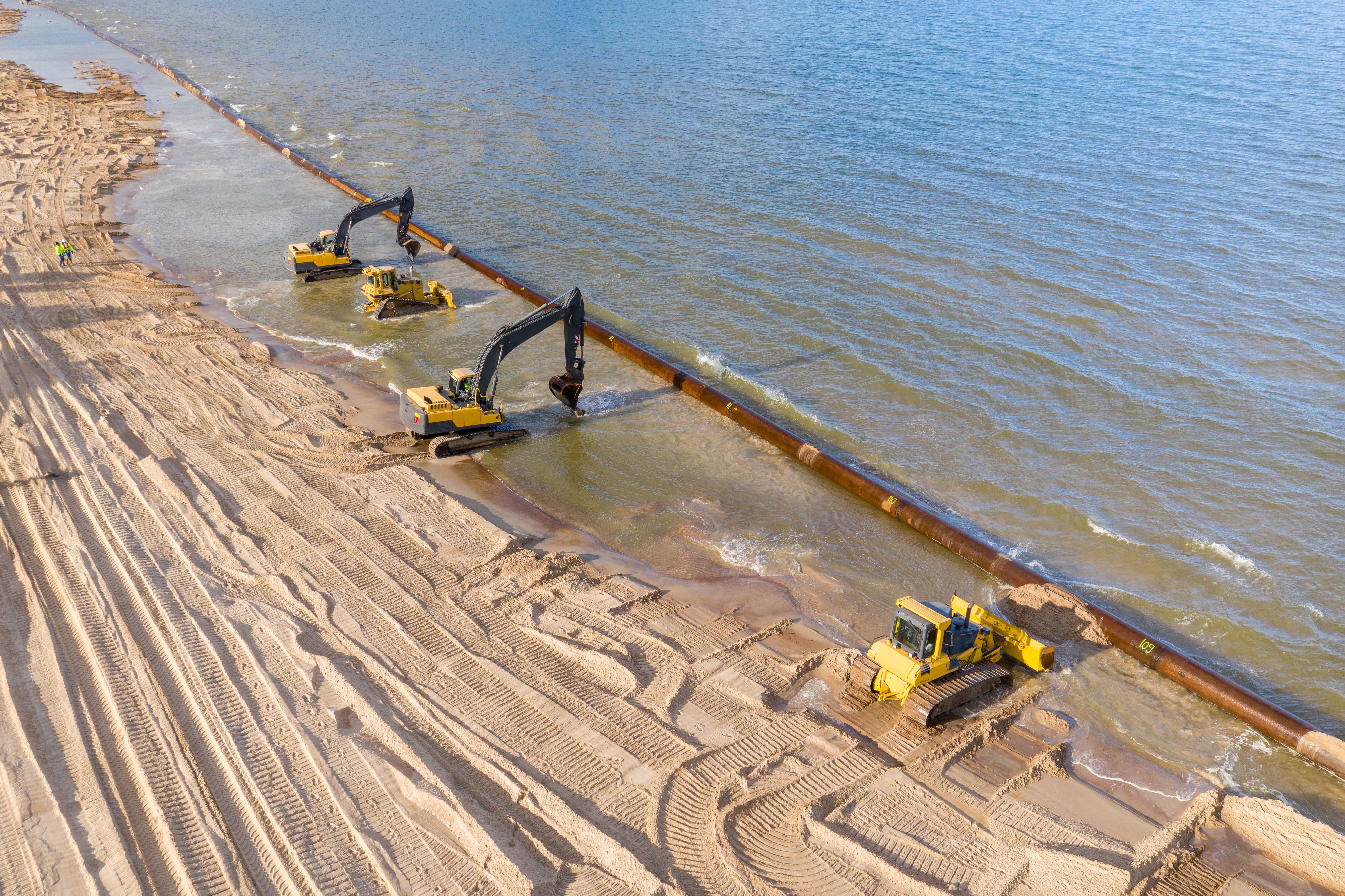 Bulldozers on beach renourishment project