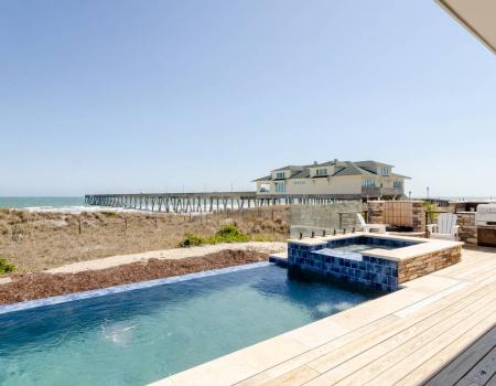 a private pool and hot tub overlooking the atlantic ocean