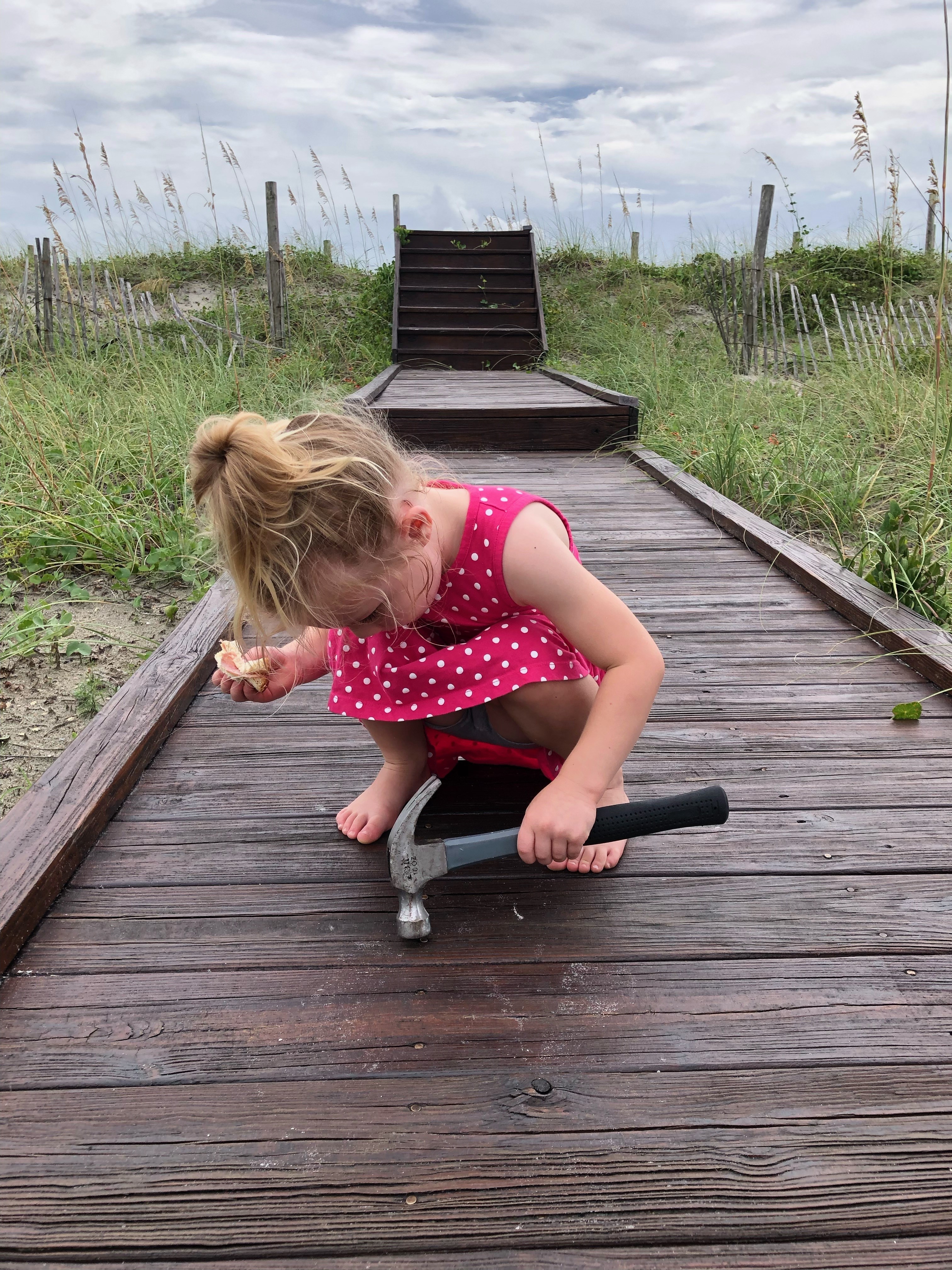 Jason's Daughter Emma working on a boardwalk while on vacation at one of Bryant Real Estate's Rentals Jason's Daughter Emma working on a boardwalk while on vacation at one of Bryant Real Estate's Rentals
